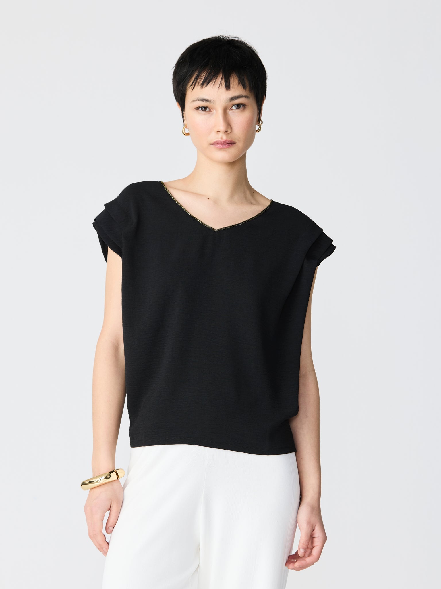 Blouse with golden details V-neck